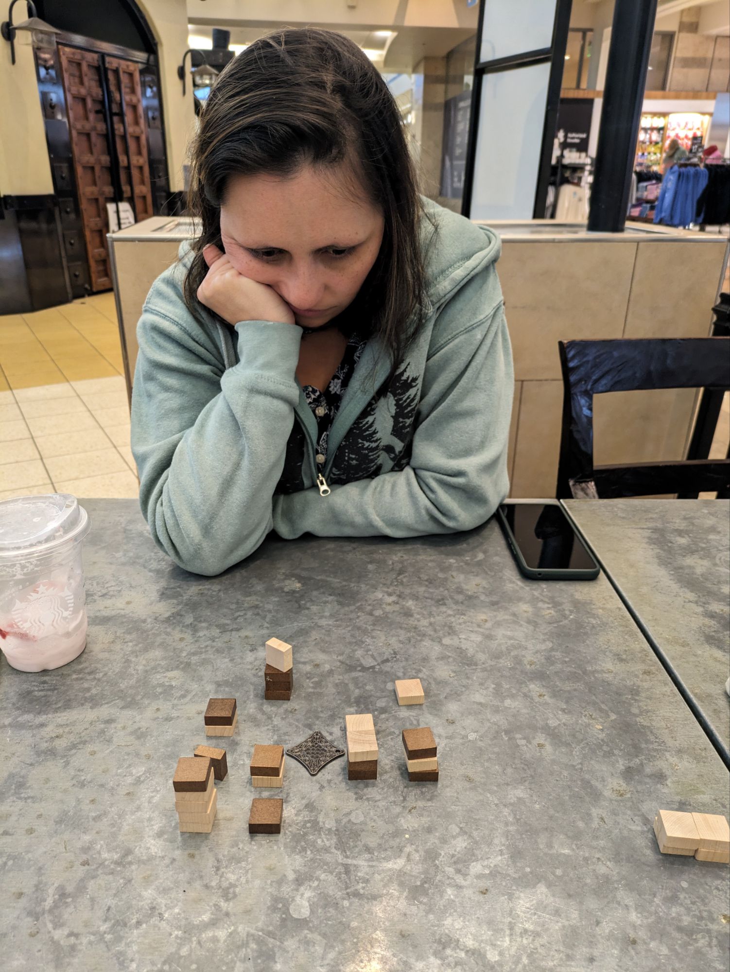 Bevin, looking like she's going to actually have a strategy for her Tak game. (But it's all a lie, she's just going to be chaotic!)