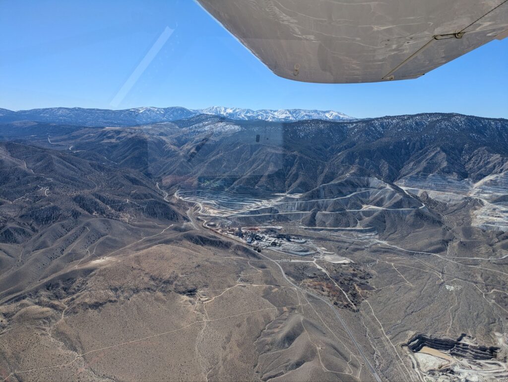 A mountain with a giant quarry or mine in it.